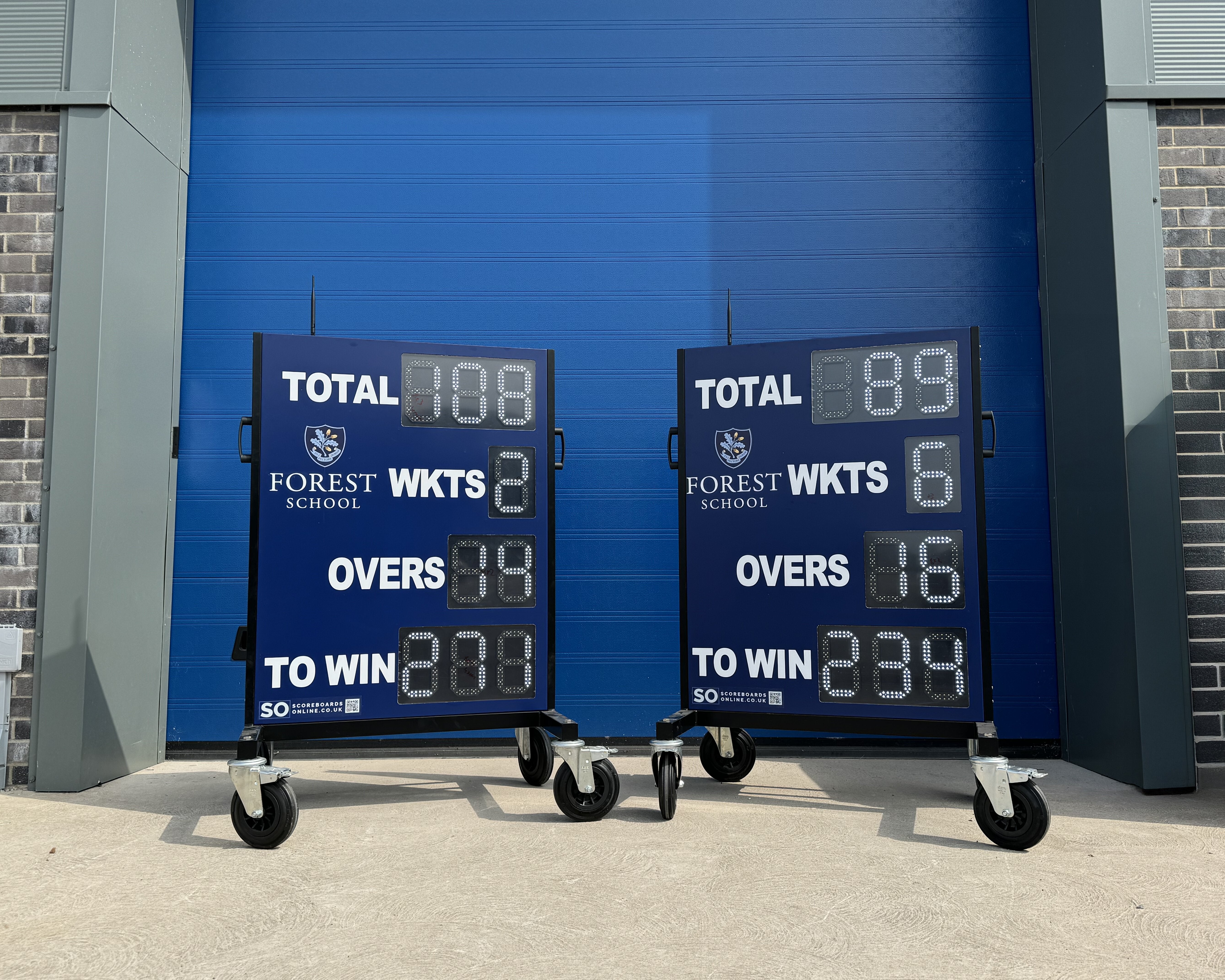 two electronic cricket scoreboards for Forest School. These personalised cricket scoreboards were painted Navy Blue and include the total, wickets, overs and to win