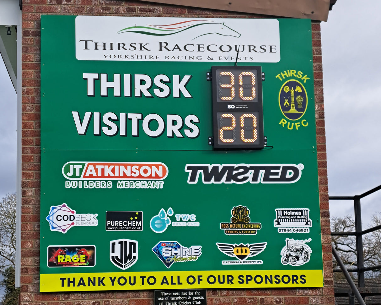 Retro-Fit Scoreboard at Thirsk RUFC with digital display and sponsor logos. High-intensity LED digits are fixed onto the Thirsk backing panel.